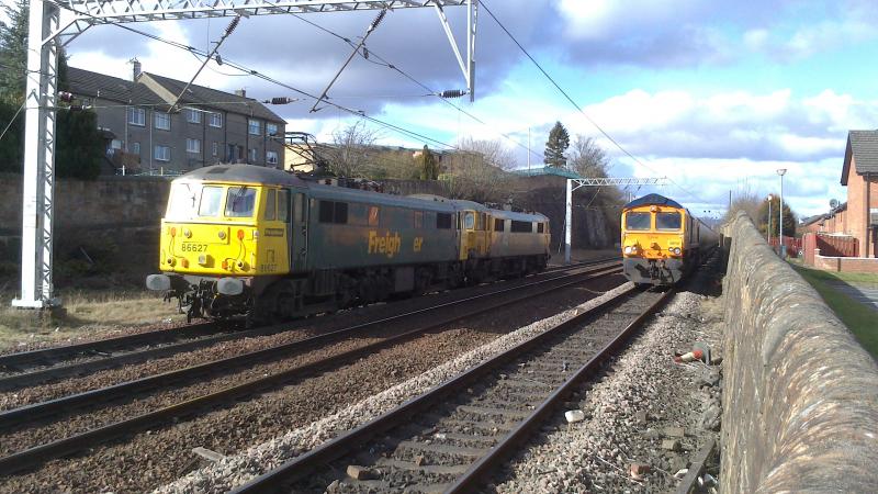86's head for Coatbridge FLT : 86627 & 86622 head for the Coatbridge FLT and pass 66737 on the southbound Alcan train (13.03.13). Photo of 86's head for Coatbridge FLT