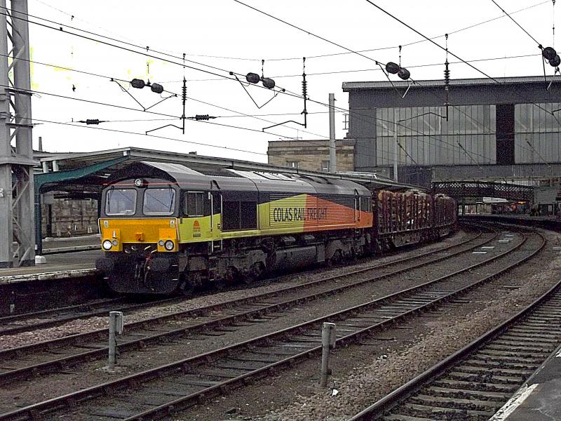 66850: Colas Rail Freight 66850 passes Carlisle station on Saturday 23rd March 2013, with 6J37, the loaded log train from Carlisle New Yard to Chirk. Photo of 66850