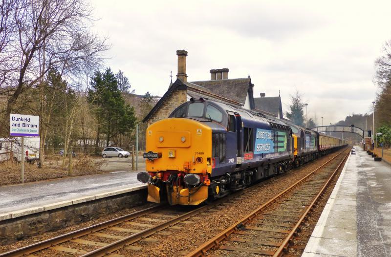 37409 and 37607 power through Dunkeld with the late running Eastern Highlander Railtour to Pitlochry on 31st March 2013 : Photo of 37409 and 37607 power through Dunkeld with the late running Eastern Highlander Railtour to Pitlochry on 31st March 2013