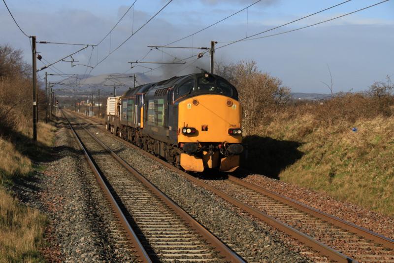 6S43 at Wallyford: 37608 + 57010 on 6S43 06.42 Carlisle to Torness Power Stn passing approaching Wallyford Stn on 16/04/2013 in full sun. Photo of 6S43 at Wallyford