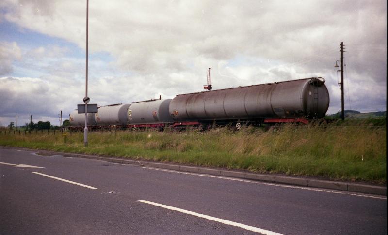Mixed Aviation fuel tanks at Leuchars in 1988: A mixed rake of Aviation Fuel tanks at RAF Leuchars in 1988 Photo of Mixed Aviation fuel tanks at Leuchars in 1988