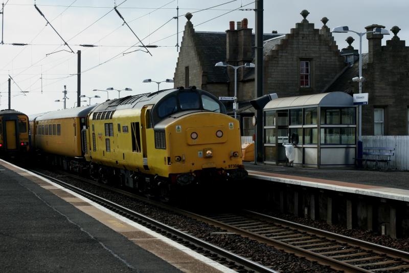 1Q13: 97304 (37217)t&t31106 1Q13 Derby -- Millerhill passing Kirknewton.156500 in background awaiting signal after 97304 cleared Mid Calder Jct. Photo of 1Q13