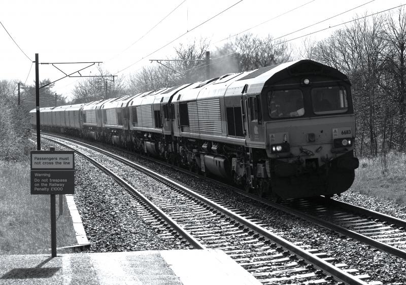 Stock Move at Longniddry: Sunday 28th April 2013: 66113 66095 66158 and 66232 lead Royal Mail-liveried EMU unit 325014 through Longniddry just after a heavy shower at 1648. Photo of Stock Move at Longniddry