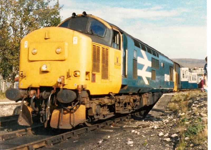 37421: Seen at Achnasheen is 37421 heading the 06.10 Inverkeithing-Kyle of Lochalsh Scotrail Explorer.This was taken with my Kodak Disc camera so not great quality. Photo of 37421