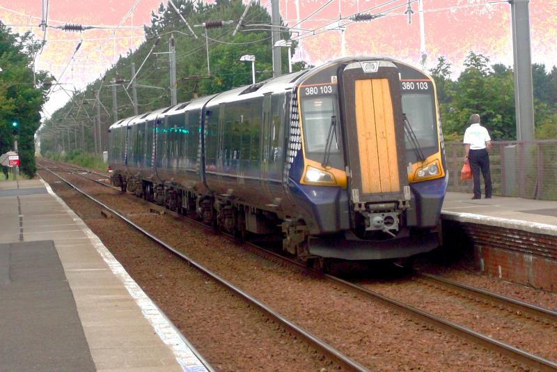380103 at Barassie: Seen approaching Barassie on a Glasgow Central to Ayr service, 4 Car 380103 arrives at the station on Wednesday 10th July 2013. Photo of 380103 at Barassie