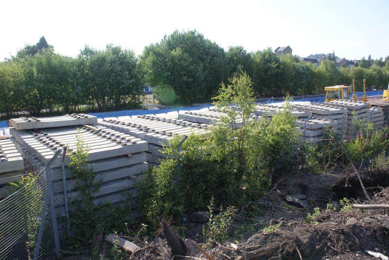 Photo of Stacks of concrete sleepers at the former Stirling Engineer's Sidings. 21.07.13