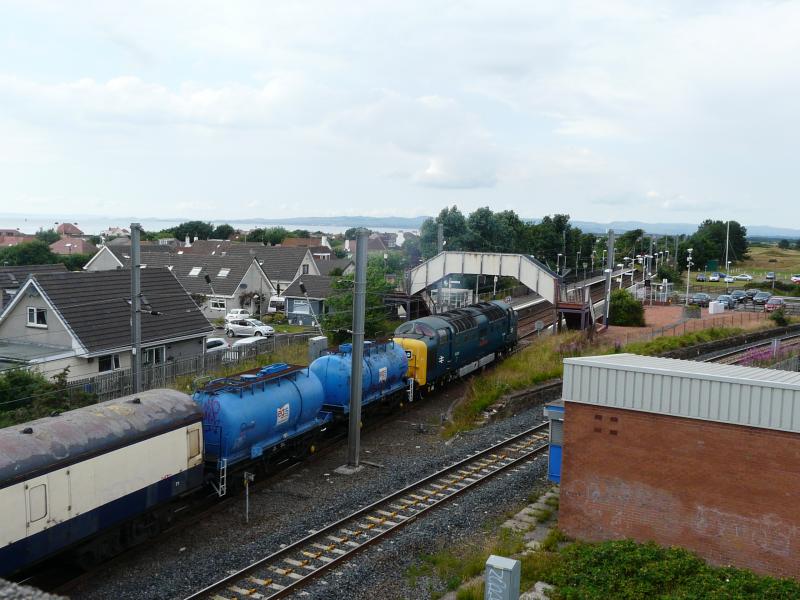Deltic 22 departing from Barassie: 55022 is captured leaving Barassie station en route to Yoker with 6Z54 conveying a refurbished class 334 set on 27 July 2013. Photo of Deltic 22 departing from Barassie