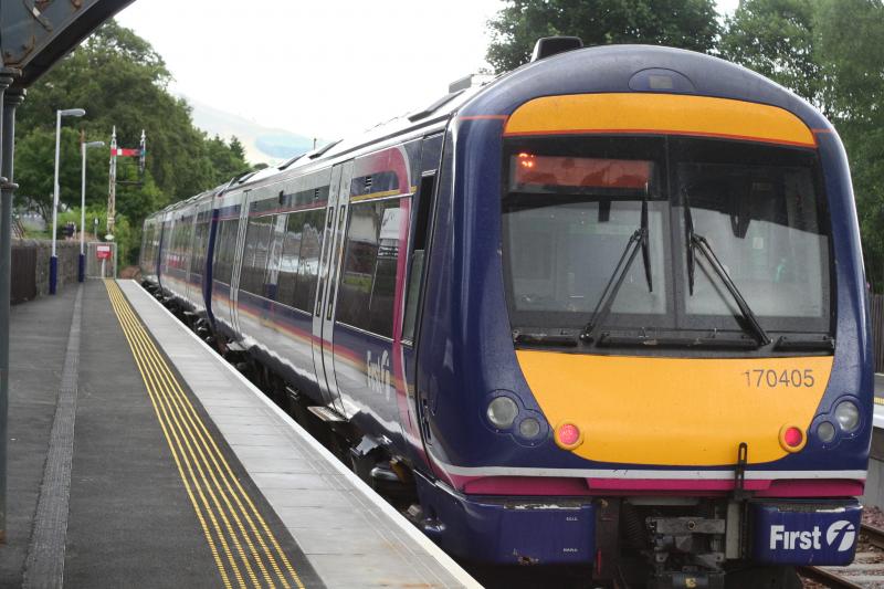 Stop signals: 170405 waits the road at Blair Atholl with the 14.49 Inverness to Glasgow service before being cautioned through the section due to a fallen tree near Pitlochry. Not a booked calling point. 29th July 2013. Photo of Stop signals
