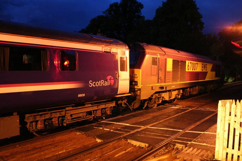 The glare of nightime lights.: 67007 lights up the bushes as it stands waiting for the off at Blair Atholl whilst working 1M16 on the 29th July 2013 Photo of The glare of nightime lights.