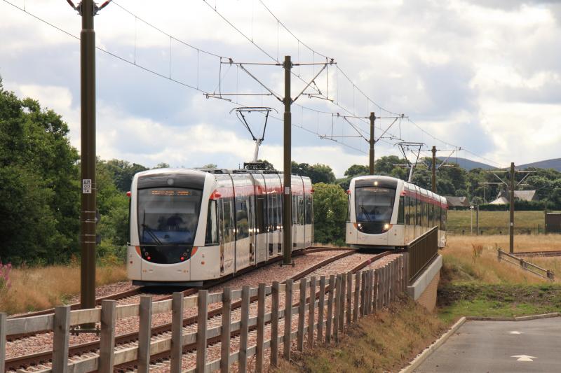Edinburgh Tram: Tram 277 en route for the depot passing Tram 276 as they pass the Hilton hotel car park at Eastfield Avenue on 31/07/2013 Photo of Edinburgh Tram