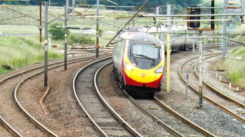 Pendo at Beattock: Taking the curve at Beattock Summit in July 2013 - a class 390 heads north. Photo of Pendo at Beattock