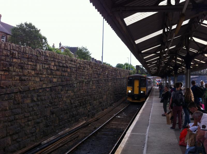 153373: A pair of class 153's roll into Truro railway station from Falmouth Docks. While on holiday down in the West Country. Sadly that train got cancelled due to the lack of the train guard. Taken with a mobile phone. Photo of 153373