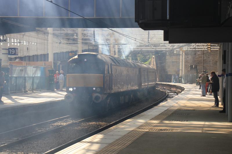 57601 with fumes: 57601 on the rear of 1Z62 06.10 London Euston to Edinburgh Waverley pollutes Platform 19 after being started up on 16/08/2013 Photo of 57601 with fumes
