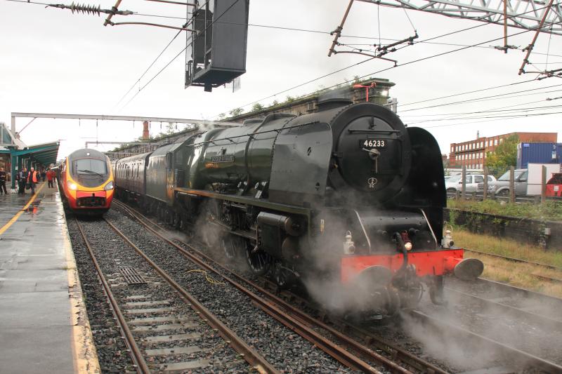 New meets Old: 390010 on 1S51 the 08.43 London Euston to Edinburgh in Platform 1 Carlisle with 46233 on 5Z29 on 17/08/2013
Photo of New meets Old