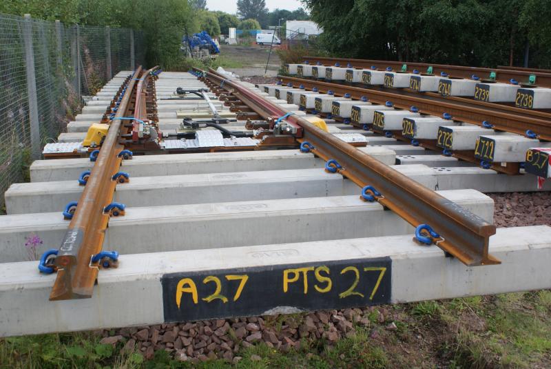 No 27 points components lie ready to be installed at Stirling: Pre-made No 27 points components lie at the bottom end of ScotRail's main Stirling car park ready to be installed. Photo of No 27 points components lie ready to be installed at Stirling