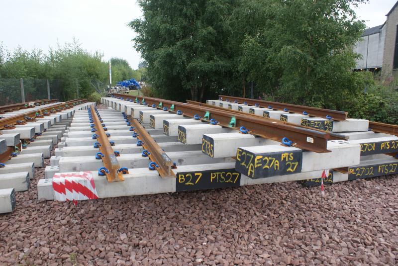 No 27 points components lie ready to be installed at Stirling.: Pre-made No 27 points components lie at the bottom end of ScotRail's main Stirling car park ready to be installed. Photo of No 27 points components lie ready to be installed at Stirling.