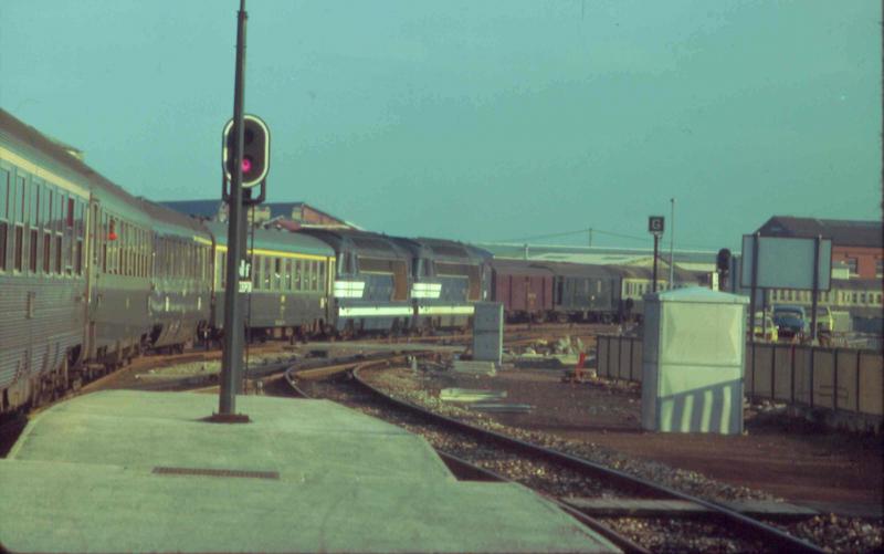 En France: Two SNCF 67xxx class locos departing on a service. Taken by the late Derrick Stewart in 1977 but sadly no other details. Photo of En France