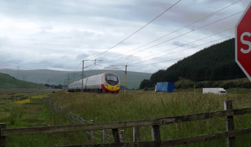 Class 390: After Shot: Pendo heads north at speed on a promising July afternoon in 2013, north of Beatock. Photo of Class 390