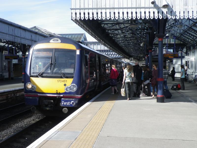 All Aboard 170 461: Passengers board a Class 170 heading south for Glasgow at Stirling Station in late March 2012. 170 Units still in First Livery. Photo of All Aboard 170 461
