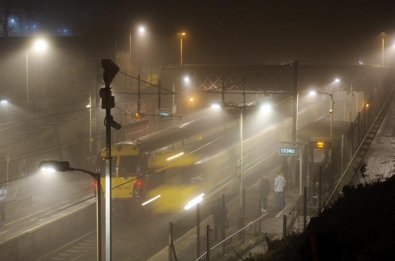 Foggy 334s.jpg: Two 334s pass Cambuslang on a Foggy December night in 2007. Photo of Foggy 334s.jpg