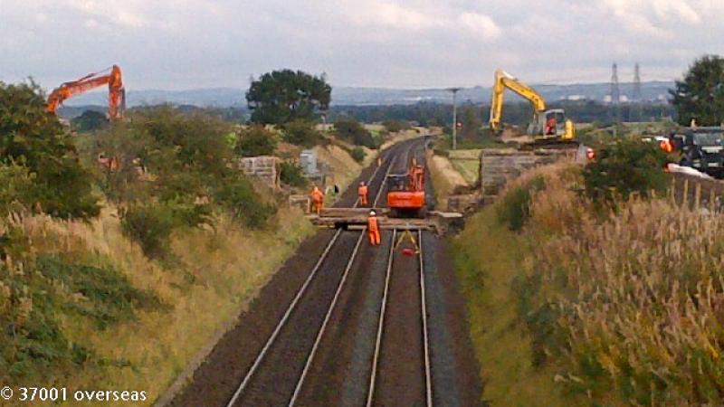Plean farm bridge is gone 2: The smaller diggers move in to collect the last remnants of the bridge that was demolished on 6th October 2013 to make way for electrification of the route through Stirling Photo of Plean farm bridge is gone 2
