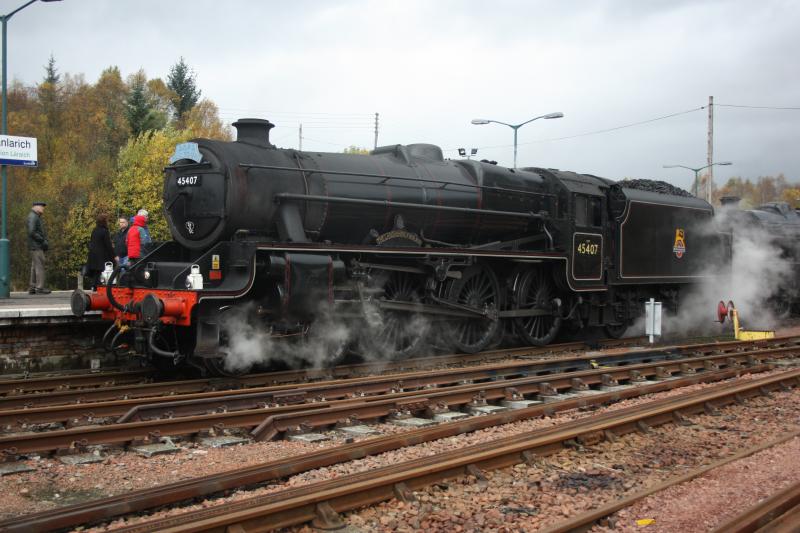 Feeding time at Crianlarich: 45407 and 44871 take on water while the support crews level the coal. Photo of Feeding time at Crianlarich