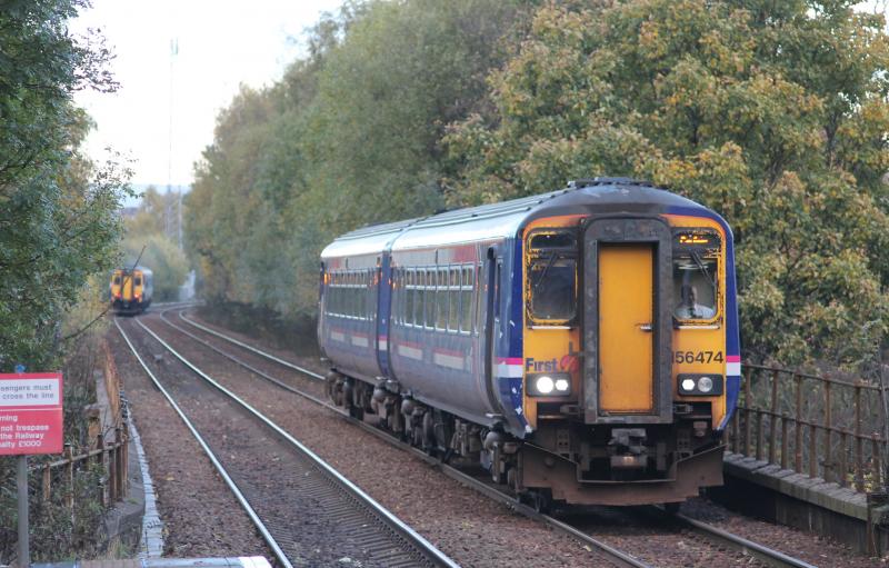 Sprinters passing: 156474 arrives at Pollokshaws West with the 1512 Glasgow-Carlisle on Sunday 3 November 2013. 'Saltire'-liveried 156434 heads away in the distance with the 1455 East Kilbride-Glasgow. Photo of Sprinters passing