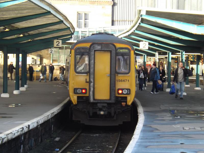 Waiting Christmas Duties: A Class 156 waits its next duty at Carlisle on 4th December 2013. Thanks to the ScotRail Driver who sounded the two tone horn for my three year old as he waved - made his day! Photo of Waiting Christmas Duties