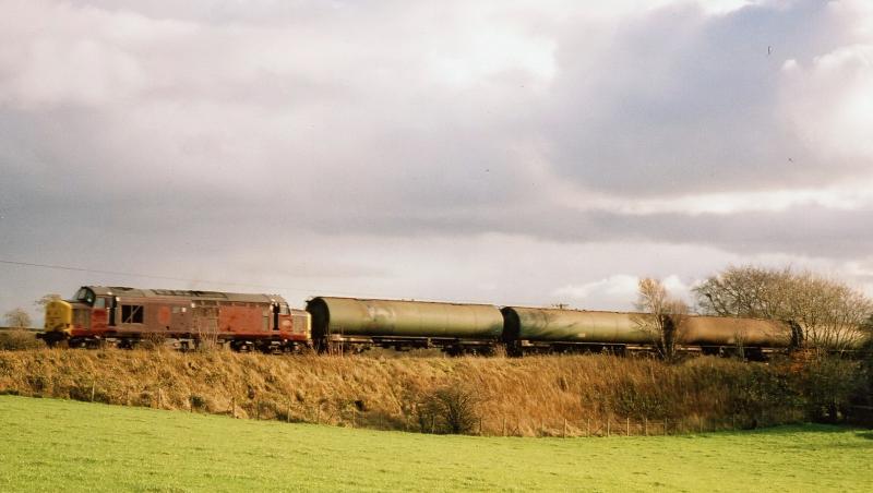 Tractor on tanks: 37401 near Kilmaurs with 6D61 Riccarton to Mossend on 15th November 2005 Photo of Tractor on tanks