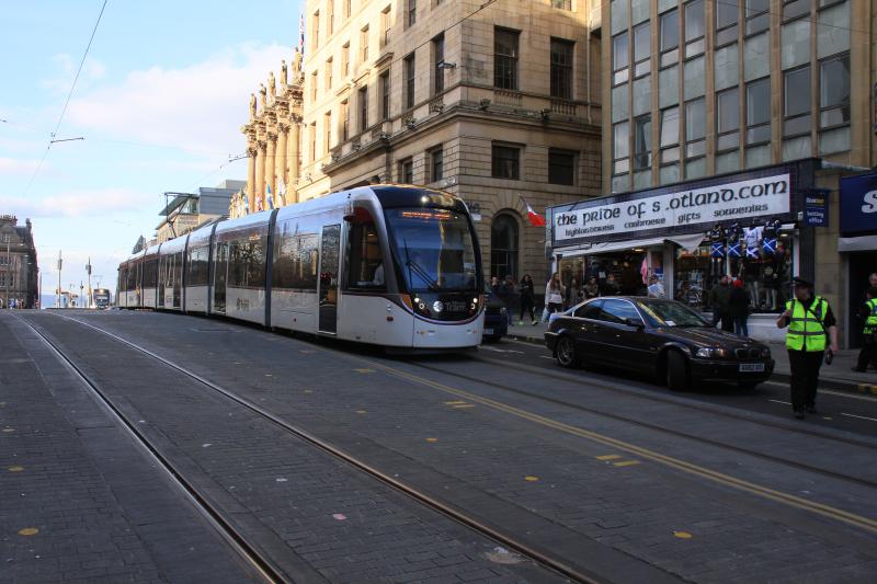 Tram Jam: Tram 277 cannot move because an idiot car driver was unable to park properly, over the white line & the front tyre was in the way. He got the attention of 2 parking attendants.Tram 257 is behind. Photo of Tram Jam