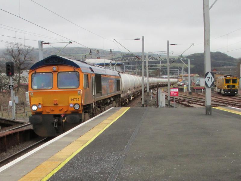 Alcan tanks: Class 66 #66735 in GBRf livery westbound at Dumbarton Central on 13 March 2014 Photo of Alcan tanks