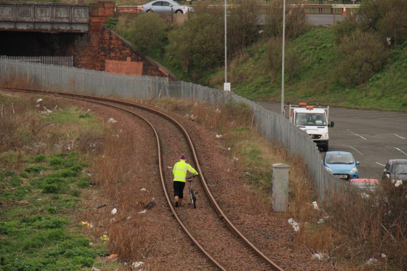 Trespassing cyclist: A brainless cyclist walking down the Leith Branch 4 minutes before 37601 came under the Bridge on 09/04/2013 Photo of Trespassing cyclist