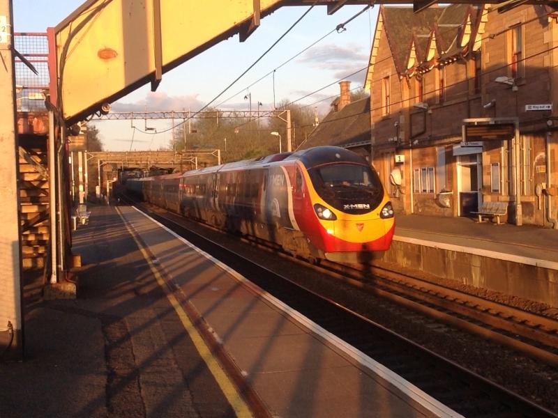 Xmen Pendolino: 390155 passes Uddingston in the faint evening sun sporting the new Xmen livery Photo of Xmen Pendolino