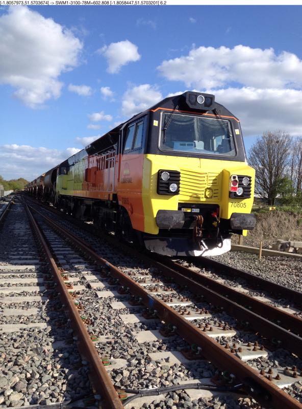 Swindon Ballast: 70805 on a Swindon - Westbury empty auto-hopper train. Loco Yard Jn, Swindon 14-04-2014. No prizes for aesthetic design or a tasteful paint job. Photo of Swindon Ballast
