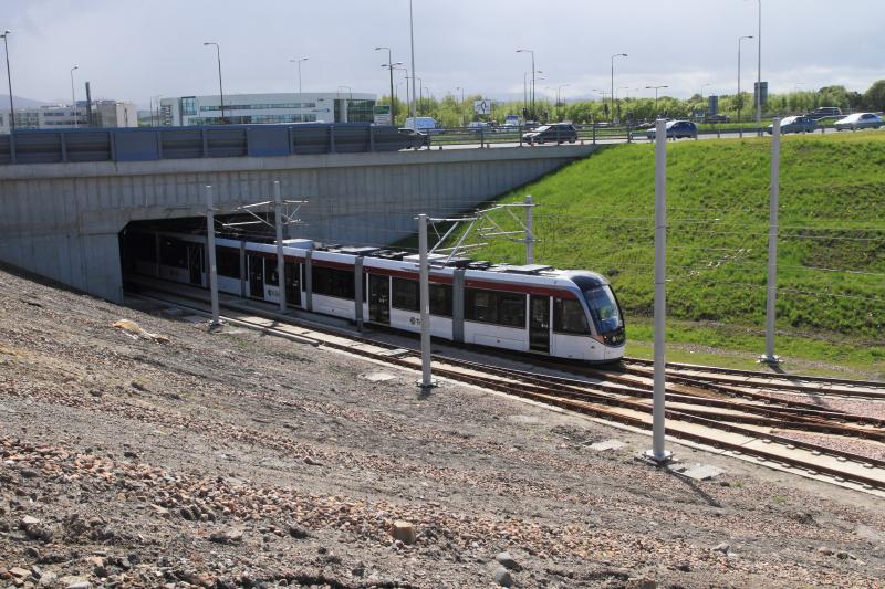 Tram 256: Tram 256 leaving the underpass at the site of the Edinburgh Gateway station on 09/05/2014 before construction. Photo of Tram 256