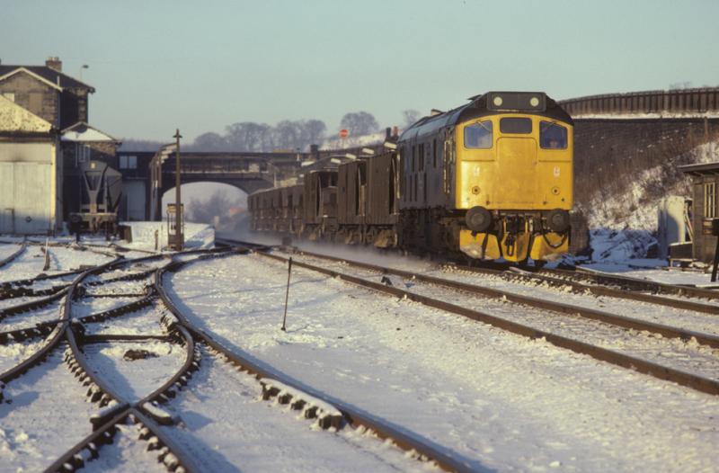 25 at Markinch: 25224 raises a slight snow flurry as it passes Markinch with a southbound ballast train. 7th Jan 1982 Photo of 25 at Markinch