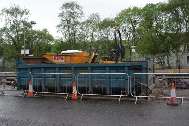 Dunblane new footbridge works: A dumper from the Balfour Beatty new footbridge works dumped into a skip at Stirling Road, Dunblane on 17.05.2014. Photo of Dunblane new footbridge works