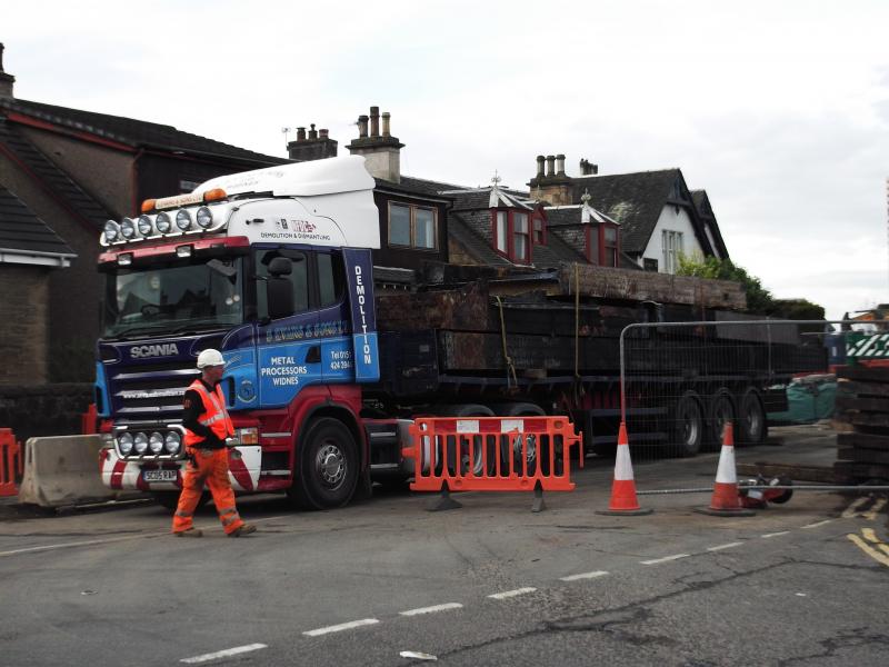 Old decking from Larbert station bridge: The truck from Widnes has a full load of old decking aboard. Photo of Old decking from Larbert station bridge