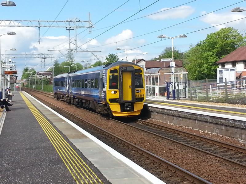 Stepp Change: A class 158 arrives at a sunny Stepps Station on 13th May 2014 bound for Cumbernauld. A big contrast to the scene in late February. Photo of Stepp Change