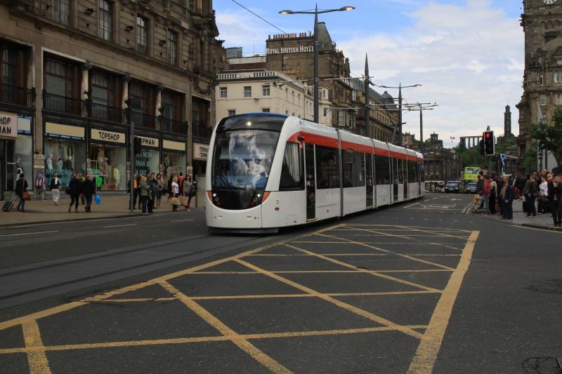 Red Stripe Tram: Tram 262 entering Princes Street from St Andrews Square running in as delivered livery on 26/05/2014 Photo of Red Stripe Tram