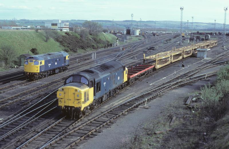Yea Olde Millerhill: 37112 shunts cartics as 26001 waits to cross over into depot. 20th April 1982 Photo of Yea Olde Millerhill