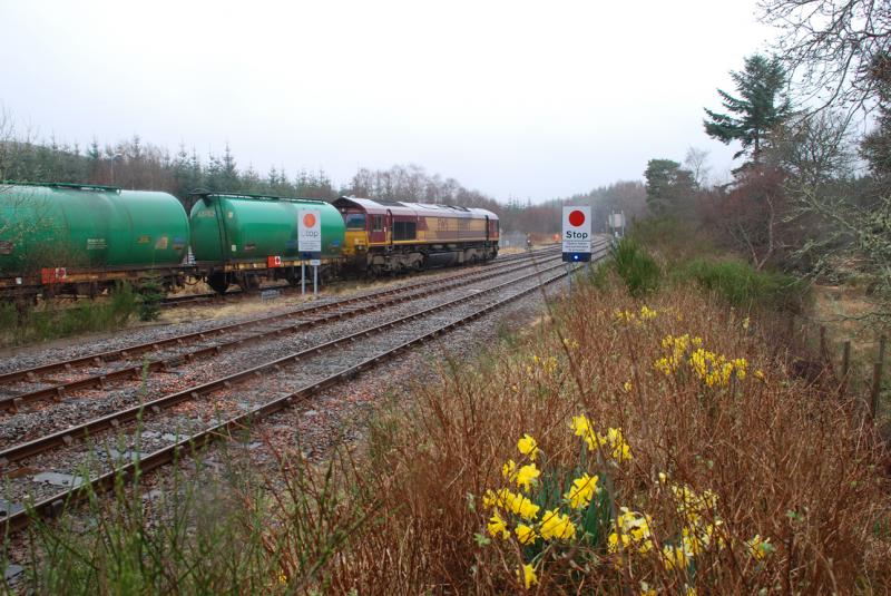 66 at Lairg: 66103 shunts the tanks at Lairg in a typical Highland downpour. 9th April 2007 Photo of 66 at Lairg