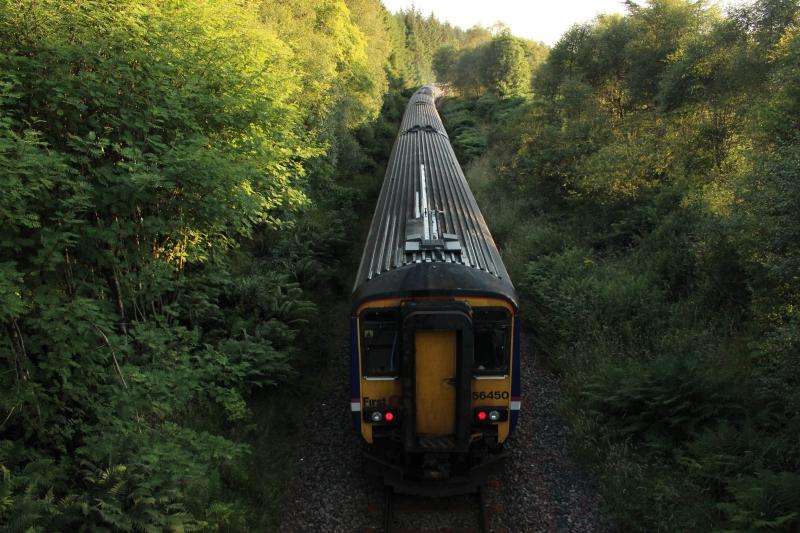 156450: 156450 apparently dead in tow brings up the rear as the eight car set heads south out of Crianlarich. 26/07/14.
Photo of 156450
