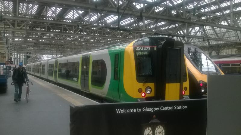 London Midland Class 350 at Glasgow Central: A London Midland set has made it's way north of the border! Photo took at Glasgow Central on 2/08/14. Photo of London Midland Class 350 at Glasgow Central