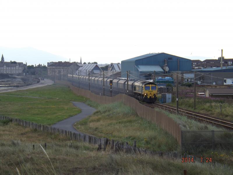 Industrial Ayrshire: A Class 66 Freightliner passes the Caravan Site at Saltcoats on July evenin in 2014. Photo of Industrial Ayrshire