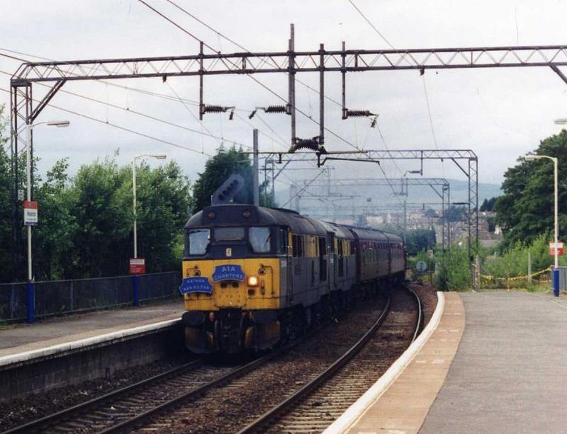 31s at Westerton: This was an A1A Society charter in August 1996 which brought a couple of Brush Class 31s to Fort William.
I took this at Westerton on the return leg heading back to Preston. The locos were 31146 BRUSH VETERAN and 31166. Photo of 31s at Westerton
