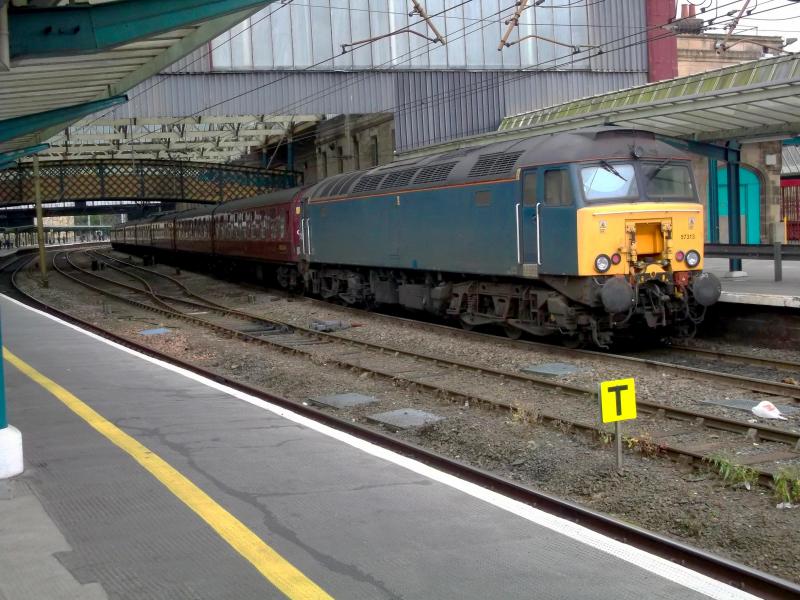 57313: Still showing it's previous Arriva colours. 57313 brings up the rear of the return stock for the Cumbrian Mountain Express at Carlisle on Saturday 16th August 2014. Photo of 57313