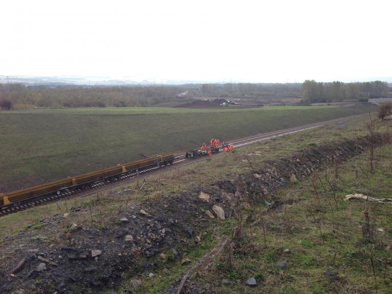 Tracklaying train at Millerhill : Push me pull you.. rails being ran off onto the Northbound road. VERY quick operation!
Date: 08 Oct 2014
Location: http://bit.ly/1pPQE49 Photo of Tracklaying train at Millerhill