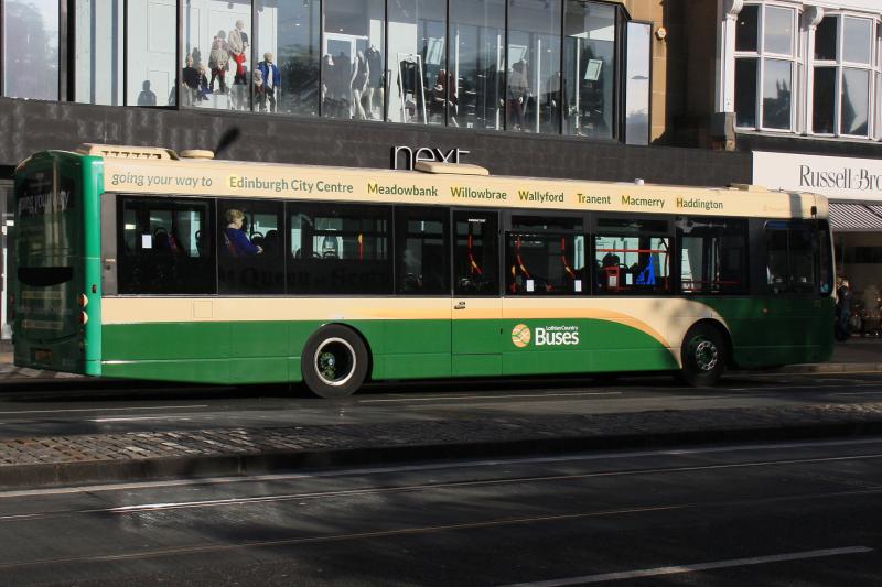 Remains of old vinyls: Lothian Country buses No 172 shows signs of its former service no 49 The Queen of Scots just like the railways. Photo of Remains of old vinyls