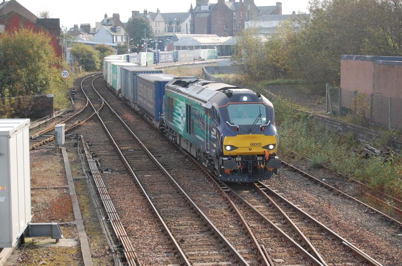 68005 Arbroath: After losing time (again!) at Barry West due to TPWS issues, 68005 Defiant rounds the curve at Arbroath and gets into stride to climb up to Inverkeilor with 4A13 Grangemouth - Aberdeen. 8/10/2014 Photo of 68005 Arbroath